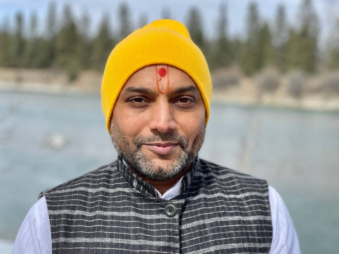 Rashesh Bhagat with the Bhartiya Multicultural Heritage Society says Hindus are asking for a quiet, safe place alongside the Bow River to perform the last rites ritual of scattering ashes into a river. (Dan McGarvey/CBC - image credit)