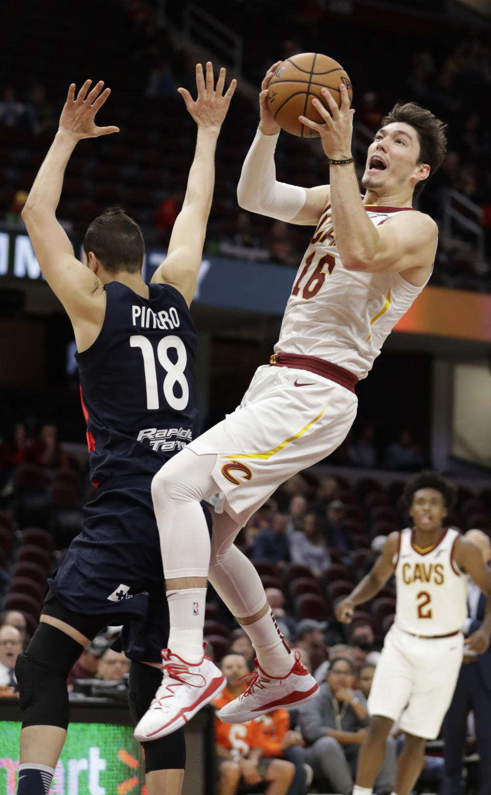 Cleveland Cavaliers' Cedi Osman (16) drives to the basket against San Lorenzo de Almagro's Facundo Pinero (18) in the first half of an NBA preseason basketball game, Monday, Oct. 7, 2019, in Cleveland. (AP Photo/Tony Dejak)