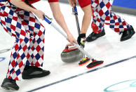 <p>A detail of the pants of team members from Norway as they sweep during the men’s curling round robin game against Switzerland on day 7 of the Vancouver 2010 Winter Olympics at Vancouver Olympic Centre on February 18, 2010 in Vancouver, Canada. (Photo by Jamie Squire/Getty Images) </p>