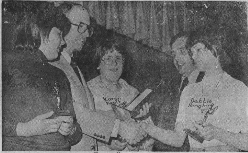 Faith Lutheran School's Debbie Heagler, right, is congratulated by Fond du Lac Reporter publisher Louie Lange Jr. for winning the Fond du Lac spelling bee in 1976. Karen Kraft, center, and Jeannette Kraus, left, came in second and third place, respectively.