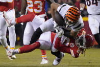 Kansas City Chiefs safety Justin Reid (20) tackles Cincinnati Bengals wide receiver Tyler Boyd (83) during the first half of the NFL AFC Championship playoff football game, Sunday, Jan. 29, 2023, in Kansas City, Mo. (AP Photo/Ed Zurga)
