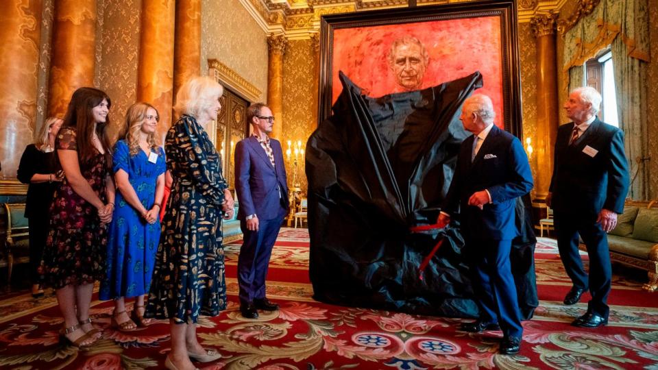 PHOTO: Britain's King Charles III and Queen Camilla at the unveiling of artist Jonathan Yeo's portrait of the King, in the blue drawing room at Buckingham Palace, in London, May 14, 2024. (Aaron Chown/AP)