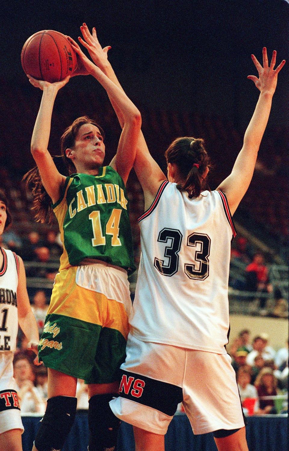 Former Canadian star Angie Gorton, left, shoots over Oklahoma Bible Academy's Jessica Rhoter in the 1997 Class A girls basketball state tournament. Gorton was named Tulsa's coach on Tuesday.