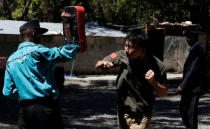 Chinese national Jack Wang a security trainer at the Chinese-run Deway Security Group leads Kenyan security guards in a martial arts combat training at their company compound in Kenya's capital Nairobi, March 13, 2017. REUTERS/Thomas Mukoya