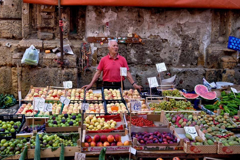 A fruit and vegetable stall at the Mercato Ballaro in Palermo.