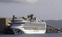 The cruise ship Ruby Princess is docked at Port Kembla as authorities prepare for the ship's departure in Wollongong, Thursday, April 23, 2020. The Ruby Princess has been ordered to leave Australia after disembarking passengers in Sydney in March that have tested positive for COVID-19. (AP Photo/Rick Rycroft)