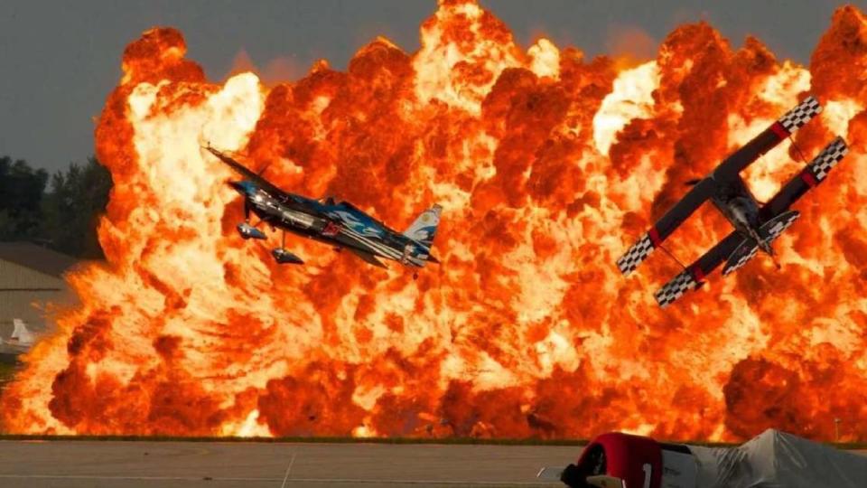 Pilots fly planes through the Firewalker International Pyro “Wall of Fire.” The owner of Firewalkers said the performance looks like chaos but is a choreographed scene.