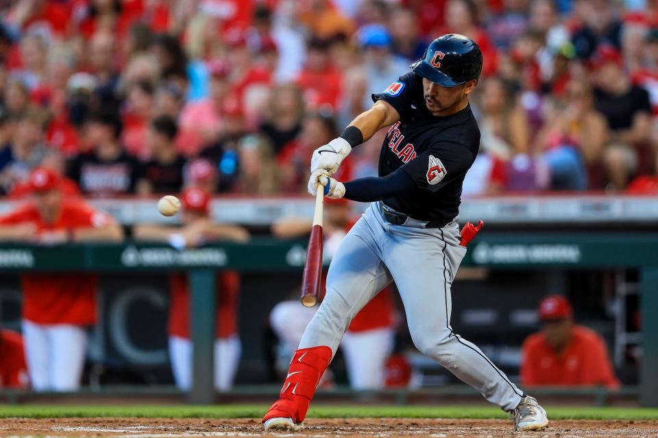 Guardians outfielder Steven Kwan hits a single against the Reds in the fourth inning, June 12, 2024, in Cincinnati.