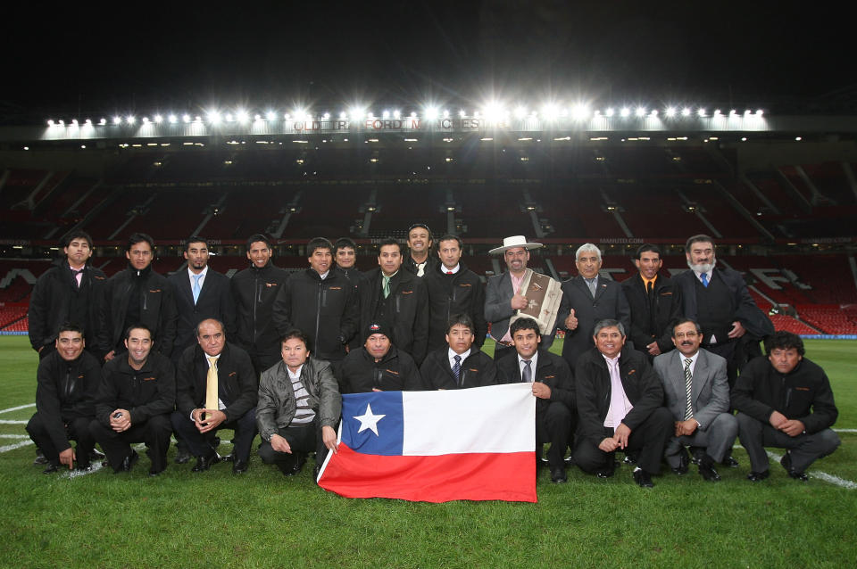 MANCHESTER, ENGLAND - DECEMBER 13:  Twenty three of the freed Chilean miners pose at Old Trafford ahead of the Barclays Premier League match between Manchester United and Arsenal on December 13, 2010 in Manchester, England.  (Photo by John Peters/Manchester United via Getty Images)