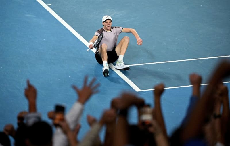 Italian tennis player Jannik Sinner reacts after defeating Russia's Daniil Medvedev during their Men’s Singles final tennis match of the 2024 Australian Open at Melbourne Park. James Ross/AAP/dpa