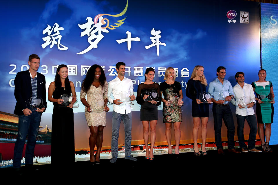 Peng Shuai, pictured here posing for a group photo with fellow players at the China Open in 2013.