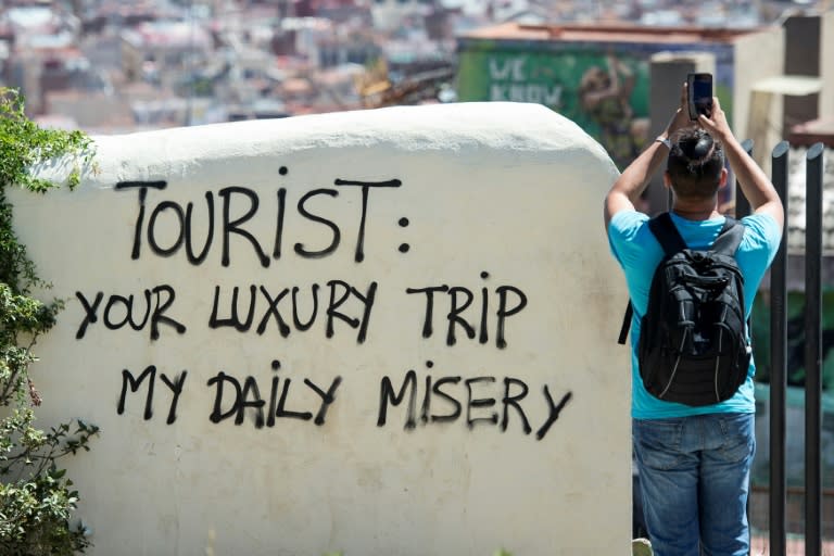 Hell is other people: Graffiti in Barcelona reflects growing resentment at the strains of mass tourism