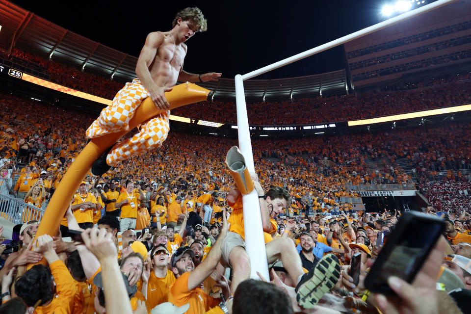 Tennessee fans tear down the goalpost after the Tennessee defeated Alabama 52-49 at Neyland Stadium on October 15, 2022 in Knoxville, Tennessee. (Photo by Donald Page/Getty Images)