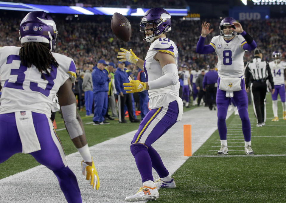 Minnesota Vikings wide receiver Adam Thielen, center, celebrates his touchdown catch with Dalvin Cook, left, and Kirk Cousins, right, during the first half of an NFL football game against the New England Patriots, Sunday, Dec. 2, 2018, in Foxborough, Mass. (AP Photo/Steven Senne)