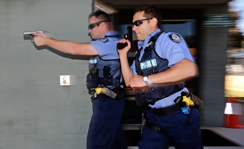 First Class Constable Michael Smith and Senior Constable Matthew McCoy demonstrate the new active shooter training. Picture: Michael Wilson The West Australian