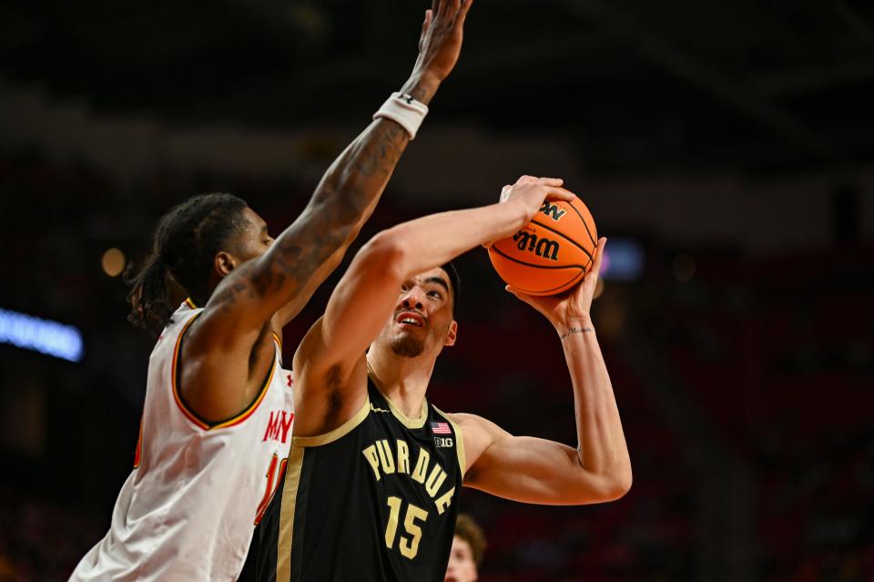 Jan 2, 2024; College Park, Maryland, USA; Purdue Boilermakers center Zach Edey (15) looks to shoot in the [paint on Maryland Terrapins forward Julian Reese (10) during the first half at Xfinity Center. Mandatory Credit: Tommy Gilligan-USA TODAY Sports
