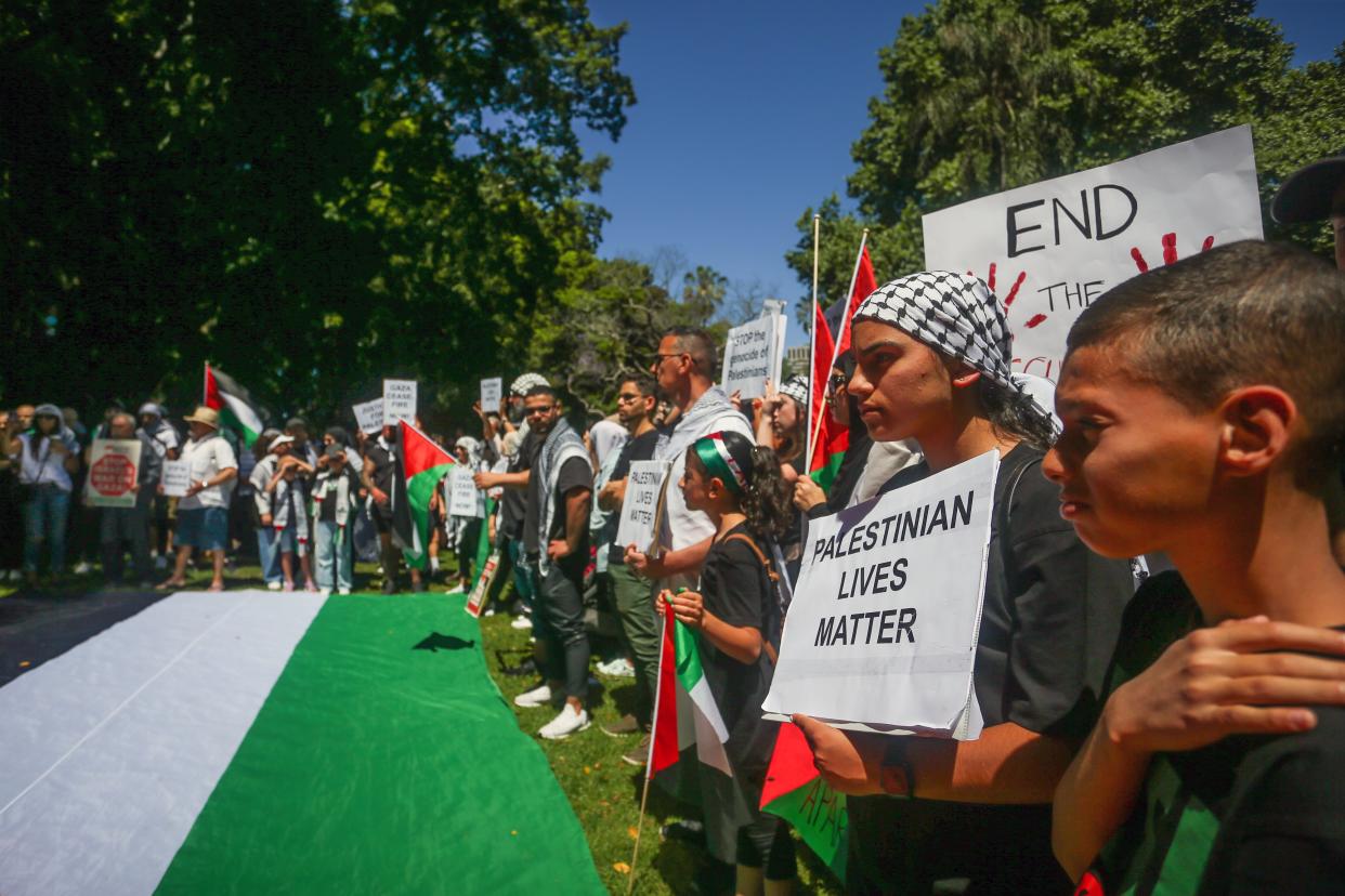 People attend a protest in support of Palestinians on October 15, 2023 in Sydney, Australia (Getty Images)