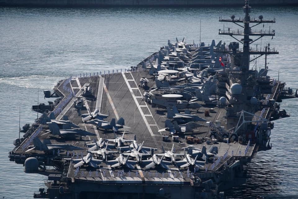 The USS Ronald Reagan (CVN 76), a US Navy Nimitz-class nuclear-powered aircraft carrier, arrives at a port in the southeastern coastal city of Busan on 23 September (EPA)