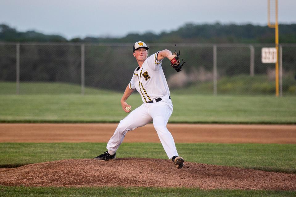 Winterset's Justin Hackett throws a pitch against Carroll on Tuesday at Winterset High School.