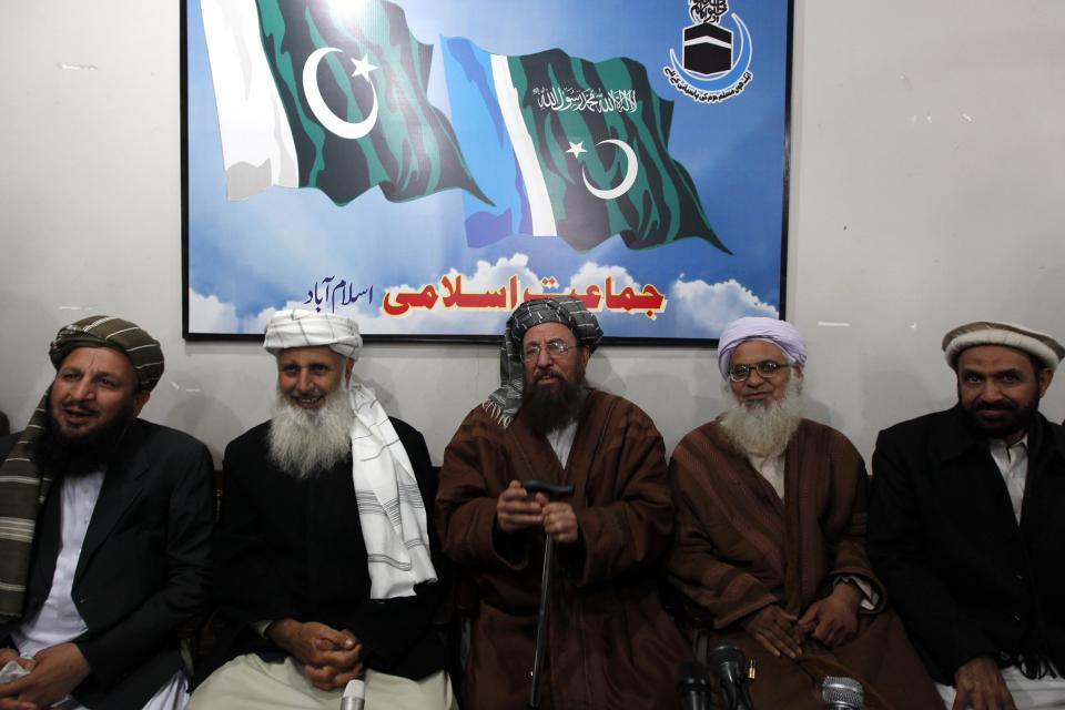 Maulana Sami ul-Haq (C), one of the Taliban negotiators, flanked by his team members Ibrahim Khan (2nd L) and Maulana Abdul Aziz (2nd R), gestures before a news conference in Islamabad February 4, 2014. Pakistan's much-awaited talks with the Taliban got off to a shambolic start on Tuesday after government negotiators failed to turn up at an agreed time following days of confusion over who should represent the insurgents. On Tuesday, a group of bearded negotiators representing the Taliban arrived at an agreed venue in central Islamabad at 2 p.m. (0900 GMT) for what had been scheduled to be the first round of talks."We arrived on time for the meeting but the government side didn't turn up," a visibly angry Haq, one of the Taliban negotiators, a radical cleric known as the Father of the Taliban, told reporters after a two-hour wait. REUTERS/Mian Khursheed (PAKISTAN - Tags: CIVIL UNREST POLITICS)