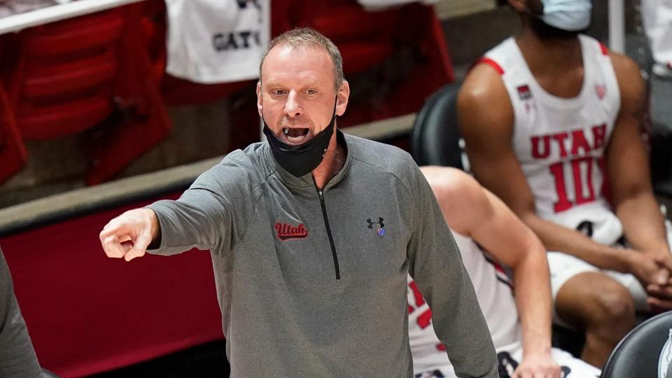 Mandatory Credit: Photo by Rick Bowmer/AP/Shutterstock (11776578k)Utah coach Larry Krystkowiak shouts to the team during the first half of an NCAA college basketball game against UCLA, in Salt Lake CityUCLA Utah Basketball, Salt Lake City, United States - 25 Feb 2021.