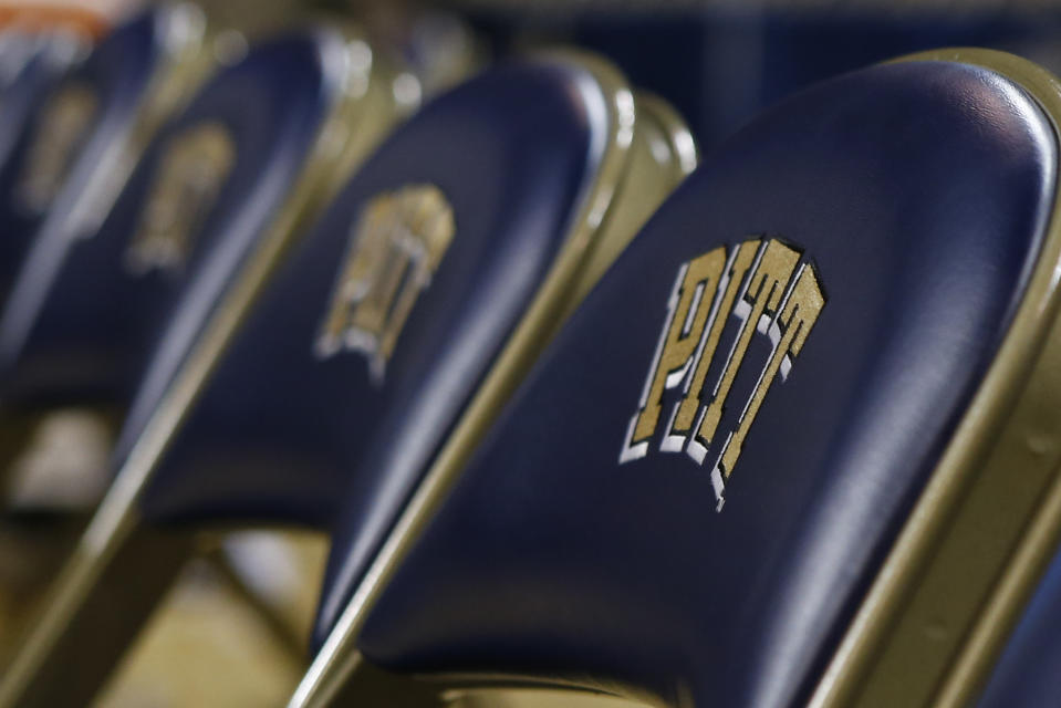 FILE- This Jan. 8, 2015, file photo shows a row of chairs with the "Pitt" logo, for the University of Pittsburgh before an NCAA college basketball game in Pittsburgh. The University of Pittsburgh is offering graduating seniors up to $5,000 in federal student loan relief with one request: They pay it forward. The school’s new program, Panthers Forward, will help recent graduates chip away at student debt and introduce them to alumni mentors to encourage professional development. Students have no obligation to repay the gift, but the university is encouraging recipients to make financial contributions to sustain the program. (AP Photo/Keith Srakocic, File)