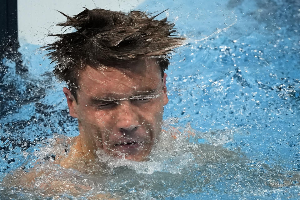 Robert Finke, of United States, celebrates after winning the gold medal in the men's 1500-meter freestyle final at the 2020 Summer Olympics, Sunday, Aug. 1, 2021, in Tokyo, Japan. (AP Photo/Jae C. Hong)