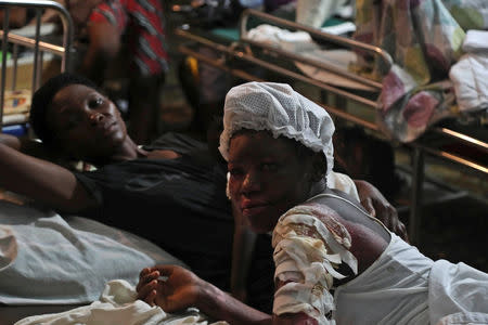 People injured in an earthquake that hit northern Haiti late on Saturday, are being looked after in a tent, in Port-de-Paix, Haiti, October 7, 2018. REUTERS/Ricardo Rojas