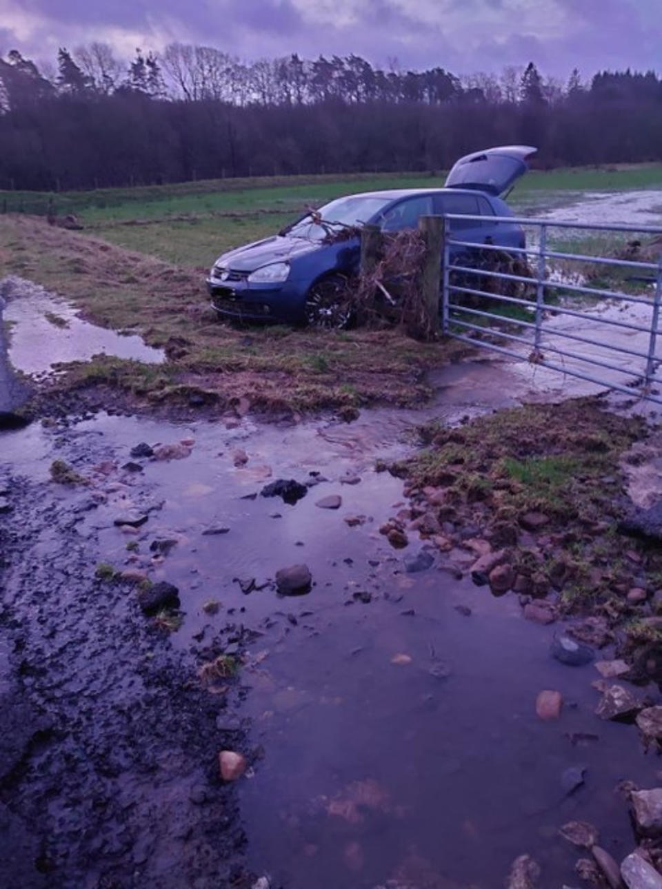 A car was swept off the road by floodwater during Storm Dennis