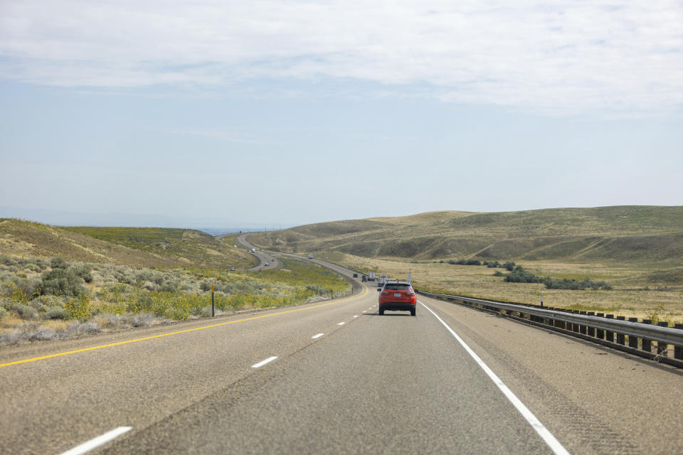 The Alderson family drives on 84 east from Baker City, Ore., on Friday, Sept. 1, 2023, to the Boise, Idaho area where Alisha is due to give birth later in September. The Alderson's are headed to Idaho where Alisha is to give birth later in September, because of the closing of Baker City's only obstetrical unit. (AP Photo/Kyle Green)