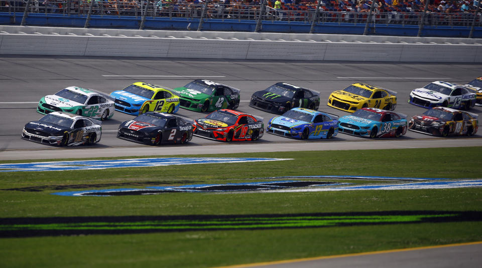 Aric Almirola (10) leads the pack as he wins Stage 1 during a NASCAR Cup Series auto race at Talladega Superspeedway, Sunday, April 28, 2019, in Talladega, Ala. (AP Photo/Butch Dill)