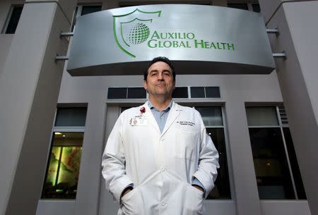 Surgeon Juan Del Rio poses for a photograph at the hospital Auxilio Mutuo, that houses liver and kidney transplant centers, in San Juan, October 20, 2015. REUTERS/Alvin Baez