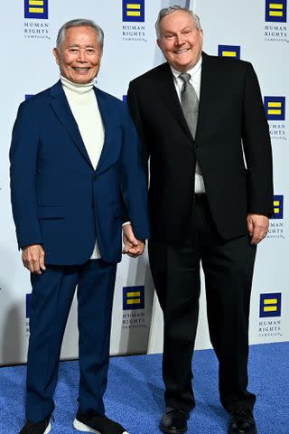 <p>Shannon Finney/WireImage</p> George Takei and his husband Brad Takei in 2022