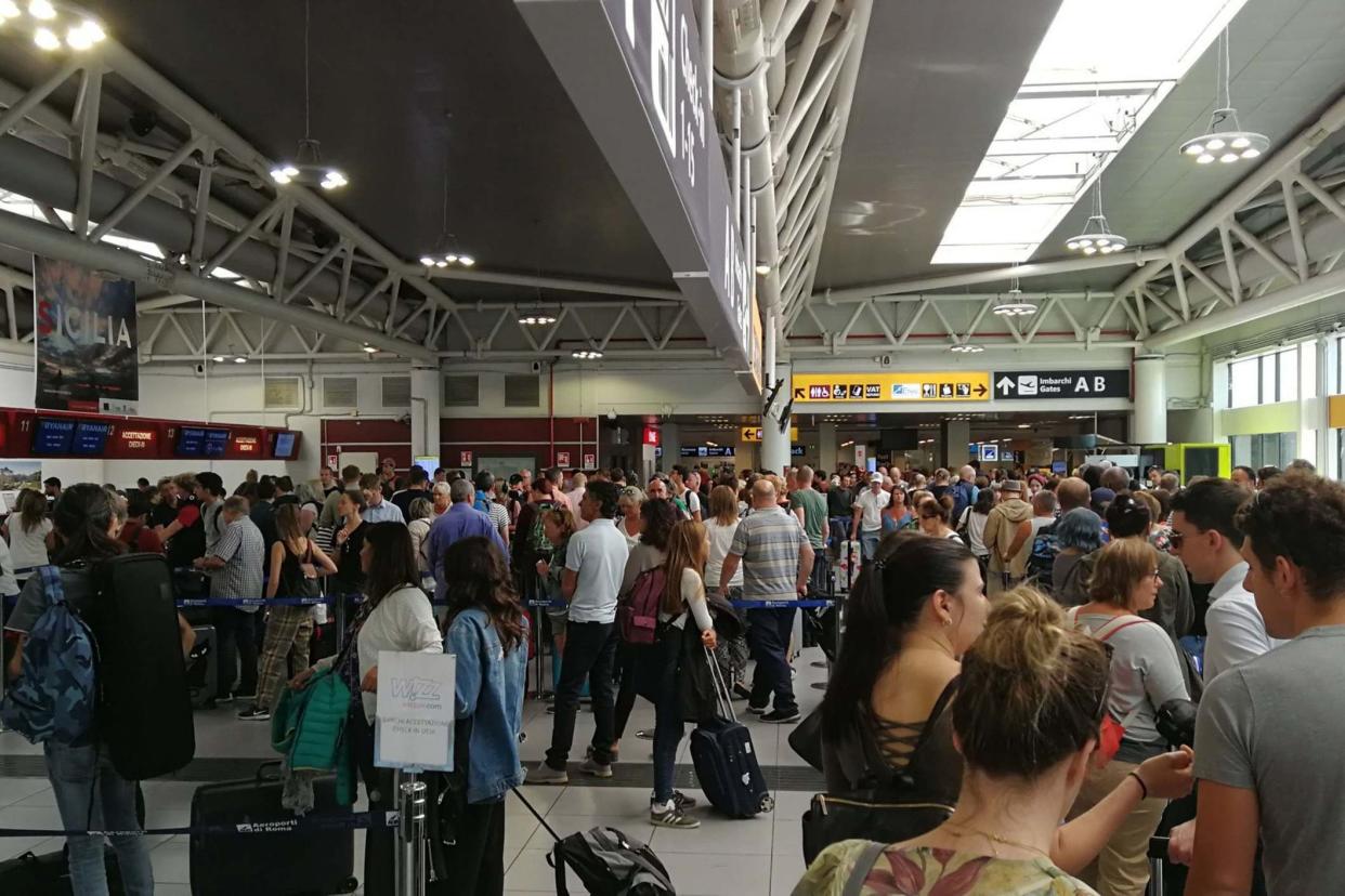 Stansted Airport on Saturday morning after Ryanair passengers were left queuing to check in due to a 'systems outage': Graeme Jolly/PA