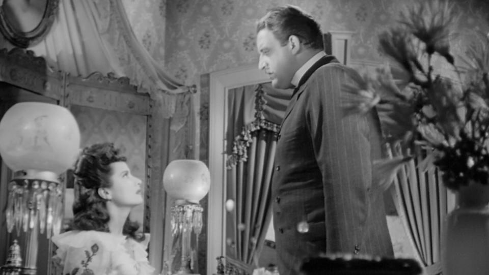 Merle Oberon and Laird Cregar look at each other in John Brahm's The Lodger