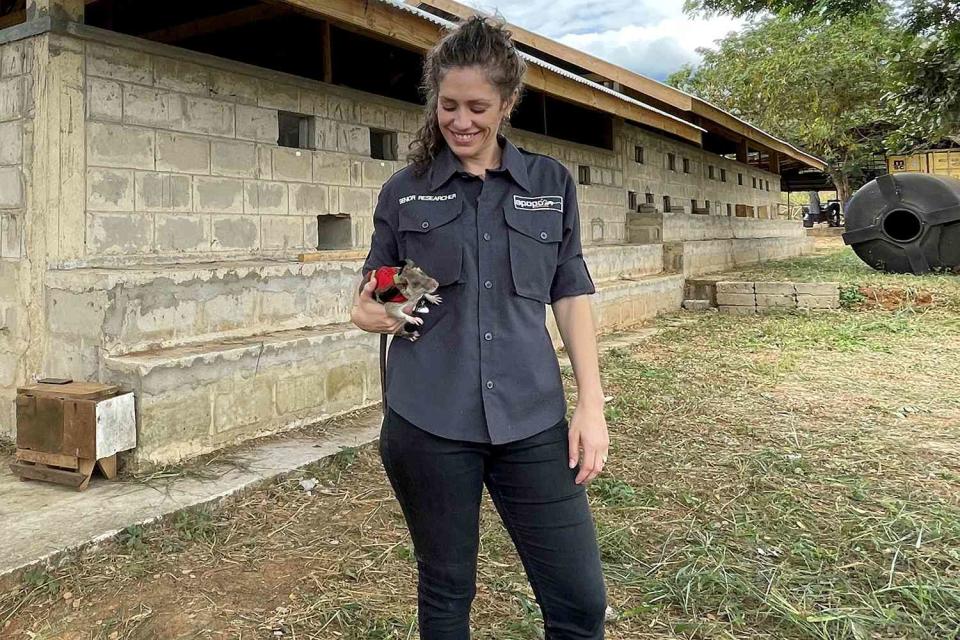 Dr Donna Kean with Jo the rat. Rats are being trained to be sent into earthquake debris wearing tiny backpacks - so rescue teams can talk to survivors.