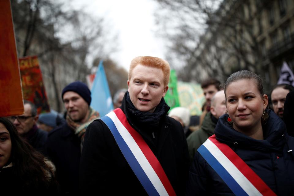 Members of French parliament Adrien Quatennens and Mathilde Panot of La France Insoumise (France Unbowed) political party attend a demonstration against French government's pensions reform plans in Paris as part of a day of national strike and protests in France, December 5, 2019.