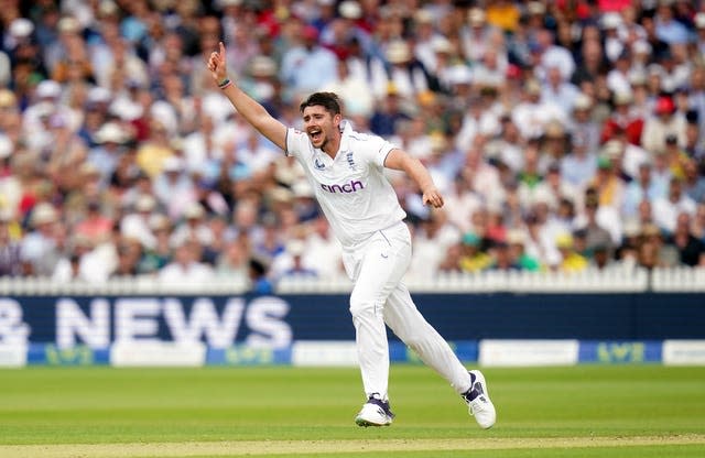 Josh Tongue celebrates taking the wicket of Australia’s David Warner