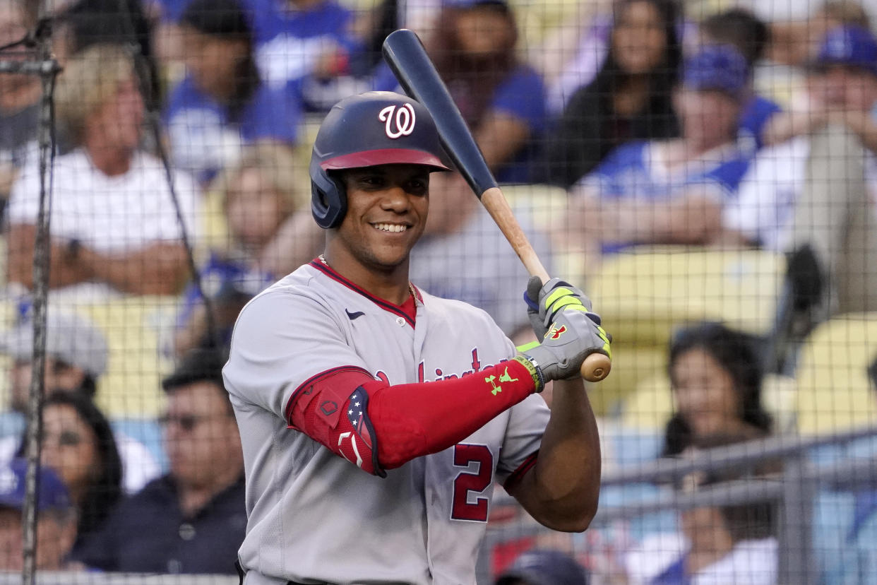 Washington Nationals' Juan Soto smiles as he stands in the on-deck circle during the first inning of a baseball game pagainst the Los Angeles Dodgers Monday, July 25, 2022, in Los Angeles. (AP Photo/Mark J. Terrill)