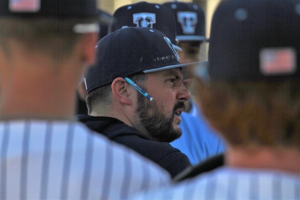 Father Tolton head coach Ehrich Chick talks to his team during a game against Lutheran St. Charles on April 11, 2023, at the Atkins Baseball Fields in Columbia, Mo,