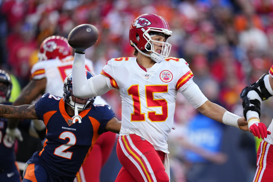 Kansas City Chiefs quarterback Patrick Mahomes (15) throws during the first half of an NFL football game against the Denver Broncos Sunday, Dec. 11, 2022, in Denver. (AP Photo/Jack Dempsey)