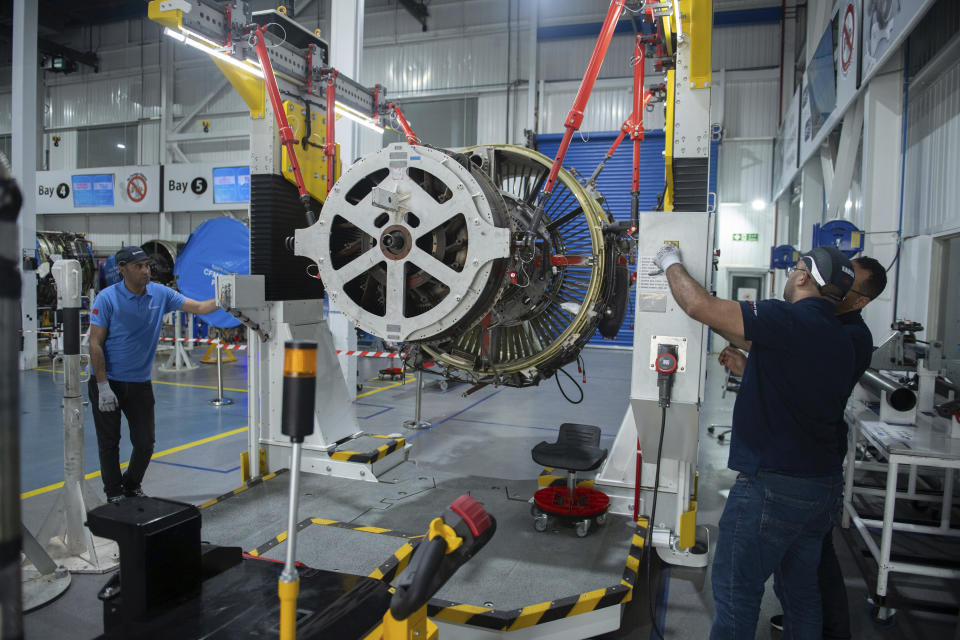 Engineers and workers stand inside Safran Aircraft Engines repair plant outside of Casablanca, Morocco, Thursday, April 18, 2024. Moroccan officials are aiming to turn the country into an aerospace hub, luring investors and manufacturers who have aimed to spread out their supply chains and find willing workers since the COVID-19 pandemic. (AP Photo)