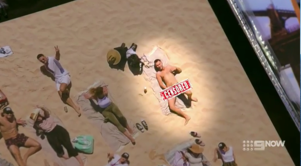 Man lying on the beach censored