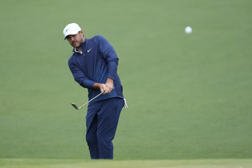 Brooks Koepka hits on the on the second hole during a practice round in preparation for the Masters golf tournament at Augusta National Golf Club Tuesday, April 9, 2024, in Augusta, Ga. (AP Photo/Ashley Landis)