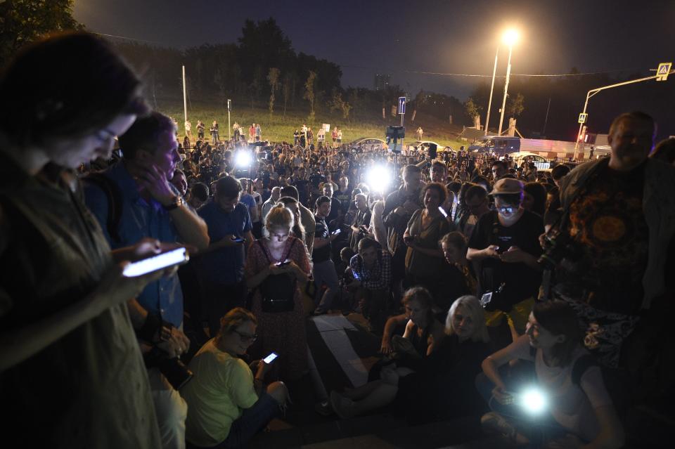 Colleagues and supporters of Ivan Golunov, a journalist who worked for the independent website Meduza gather at a court building in Moscow, Russia, Saturday, June 8, 2019. A prominent Russian investigative reporter who was detained on drug-dealing charges has been released on house arrest in a case that has raised widespread alarm among journalists. (AP Photo/Dmitry Serebryakov)