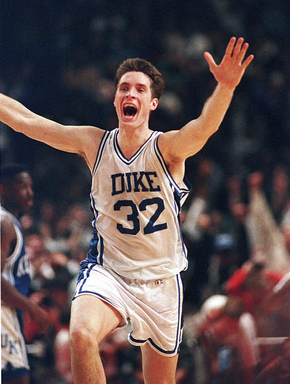 FILE - Duke's Christian Laettner runs down the court after making the last second, game-winning shot to defeat Kentucky 104-103 in overtime of the East Regional Final of the NCAA college basketball tournament in Philadelphia, March 28, 1992. (AP Photo/Amy Sancetta, File)