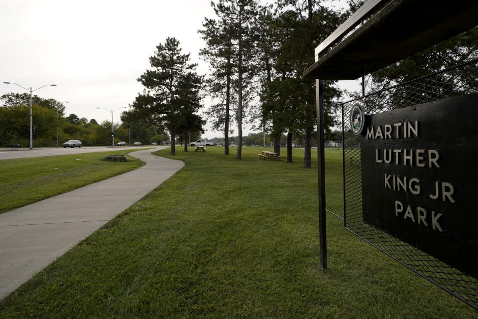 A car passes Martin Luther King Jr. park adjacent to Swope Parkway Tuesday, Sept. 22, 2020, in Kansas City, Mo. The stretch of road, along with parts of two other streets, would be renamed to honor King under a city proposal coming in the wake of failed effort to honor King last year. (AP Photo/Charlie Riedel)