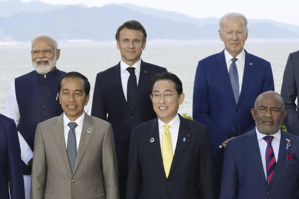 FILE - World leaders from G7 and invited countries, top row from left to right, India's Prime Minister Narendra Modi, France's President Emmanuel Macron, U.S. President Joe Biden, bottom row from left to right, Indonesia's President Joko Widodo, Japan's Prime Minister Fumio Kishida and Comoros President Azali Assoumani pose for a family photo during the G7 Leaders' Summit in Hiroshima western Japan, May 20, 2023. (Japan Pool via AP, File)