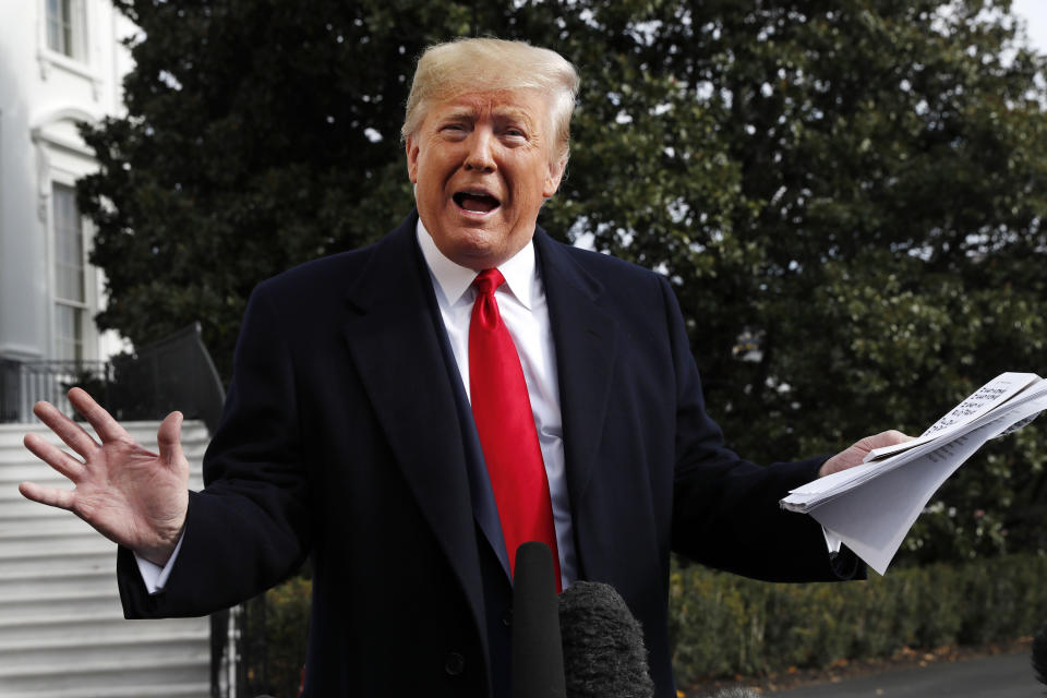 President Donald Trump holds handwritten notes as he speaks to the media about the House Intelligence Committee testimony of U.S. Ambassador to the European Union Gordon Sondland, Wednesday, Nov. 20, 2019, as Trump leaves the White House in Washington, en route to Texas. (AP Photo/Jacquelyn Martin)