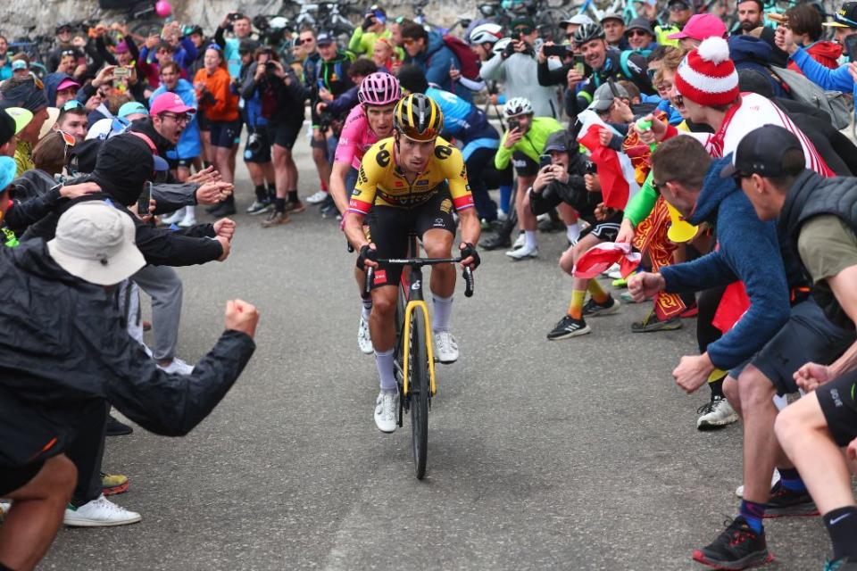 Spectators cheer as JumboVismas Slovenian rider Primoz Roglic and overall leader INEOS Grenadierss British rider Geraint Thomas Rear cycle in the last kilometers of the final ascent during the nineteenth stage of the Giro dItalia 2023 cycling race 183 km between Longarone and Tre Cime di Lavaredo rifugio Auronzo on May 26 2023 Photo by Luca Bettini  AFP Photo by LUCA BETTINIAFP via Getty Images